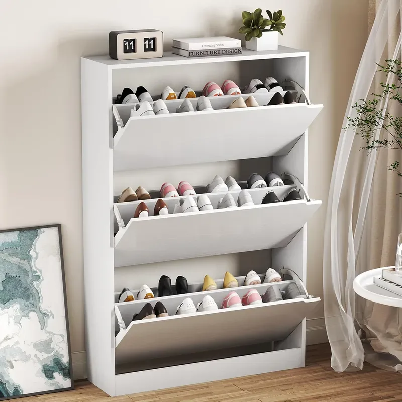 A white BORNOON shoe cabinet with three tilt-forward drawers