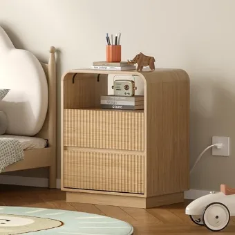 Oak bedside table with a charging shelf beside a low bed