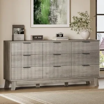 Extra-wide fluted chest of drawers standing below a round mirror